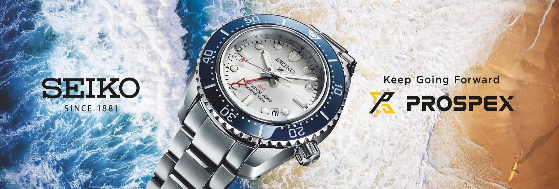 A Seiko Prospex wristwatch with a silver stainless steel bracelet, white dial, and blue bezel, set against a split background of ocean waves on the left and sand on the right, with the Seiko and Prospex branding visible.
